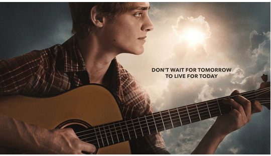 A Disney character strums a guitar beneath a partly cloudy sky, sunlight streaming down. The on-screen message: “Don’t wait for tomorrow to live for today.” Discover inspiring new shows coming soon to Disney+, with more magical January releases ready to help you make every day unforgettable.