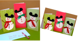Three festive Snowman greeting cards, each sporting classic black hats and scarves reminiscent of the joyful holiday spirit sparkling throughout Main Street U.S.A., are ready for your magical season's wishes. The set is completed by a bright blue envelope addressed to "Santa North Pole," evoking the charm and excitement of sending Christmas lists straight from the heart of your favorite holiday-themed park.