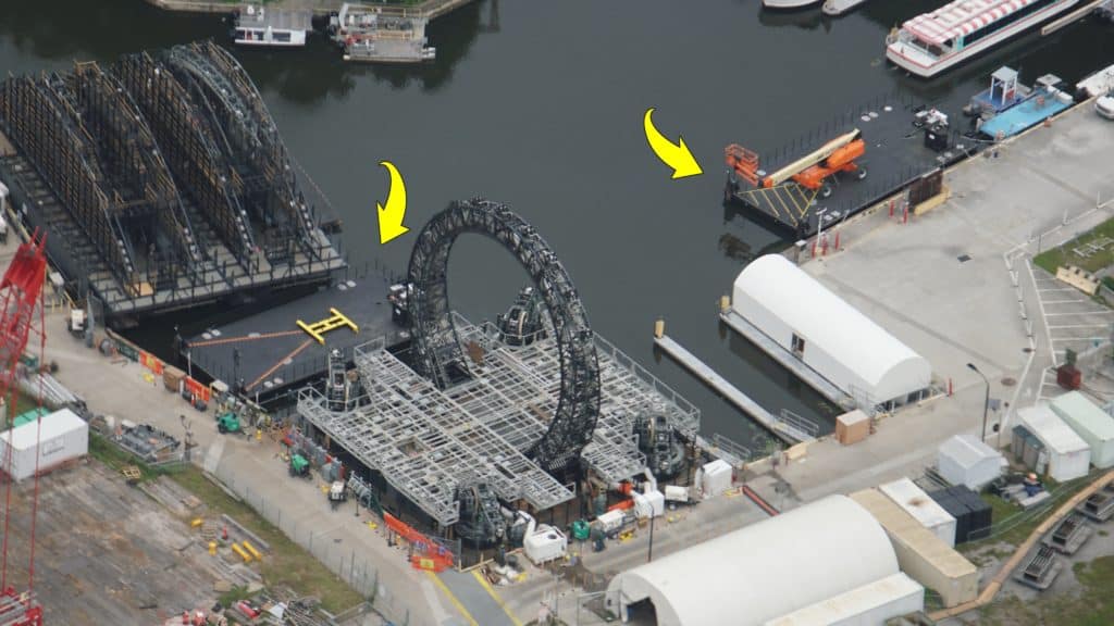 Aerial view of EPCOT’s World Showcase lagoon as the massive circular stage for HarmonioUS takes shape, surrounded by boats and docks, signaling exciting preparations for the spectacular new nighttime show.