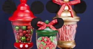 Add some Disney flair to your festivities with three Mickey Mouse-inspired Sweet Jar Centerpieces packed with colorful ornaments, festive gumdrops, and classic candy canes—each topped off with a signature red bow for that magical Mickey and Minnie touch you’d find on Main Street, U.S.A.