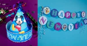 Blue party hat featuring Mickey Mouse and a bold "NEW YEAR" design, paired with a vibrant DIY hat and an eye-catching "Happy New Year" banner on a blue wall—capturing the magic of Disney’s New Year celebration setup, perfect for fans enjoying the festivities in the park.