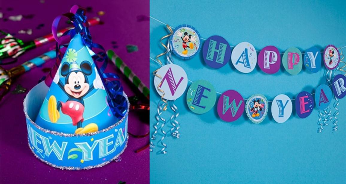 Blue party hat featuring Mickey Mouse and a bold "NEW YEAR" design, paired with a vibrant DIY hat and an eye-catching "Happy New Year" banner on a blue wall—capturing the magic of Disney’s New Year celebration setup, perfect for fans enjoying the festivities in the park.