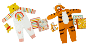 Two playful baby gift sets inspired by beloved theme park characters, each featuring whimsical animal hats, cuddly plush toys reminiscent of favorite attractions, and vibrant blankets folded beside them—perfect souvenirs for welcoming the newest little fans.