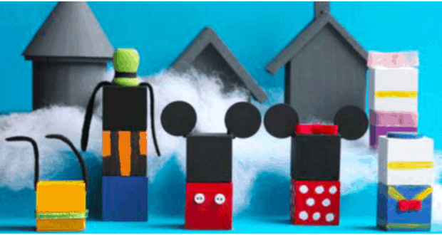 Beloved Disney characters made from vibrant building blocks populate a magical scene straight out of a whimsical Disney Winter Village, complete with charming themed houses and puffy clouds, evoking the enchanting atmosphere of Main Street during the holidays at a Disney park.