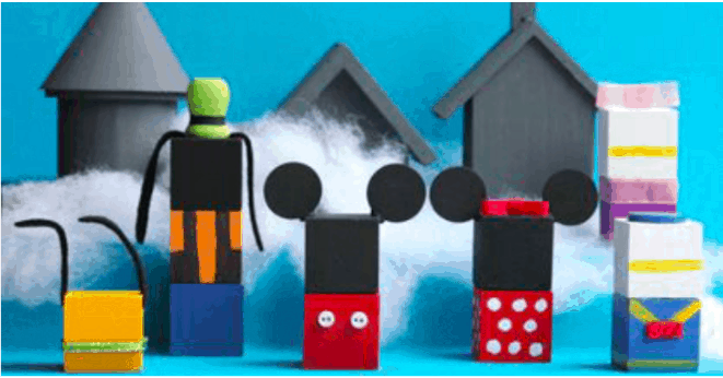 Beloved Disney characters made from vibrant building blocks populate a magical scene straight out of a whimsical Disney Winter Village, complete with charming themed houses and puffy clouds, evoking the enchanting atmosphere of Main Street during the holidays at a Disney park.