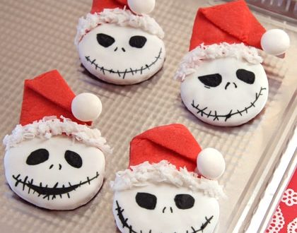 Sandy Claws Cookies, featuring Jack Skellington sporting cheerful Santa hats, await guests on a silver tray—an irresistible holiday treat found during festive celebrations at Disneyland.