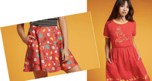 Two girls in vibrant, patterned red dresses from the latest Hot Topic collection channel energetic theme park vibes as they pose against an orange backdrop, radiating excitement and fun perfect for a day at Universal Studios.
