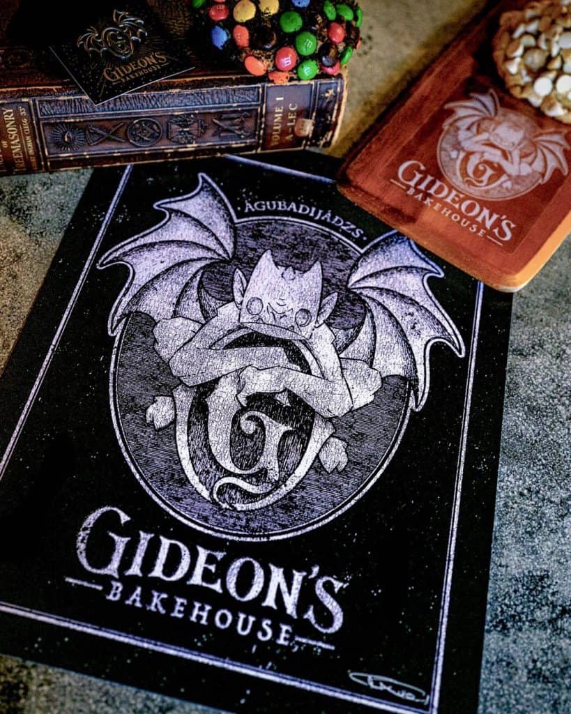 Step into the excitement of Gideon's Bakehouse Grand Opening at Disney Springs, showcasing their menu alongside a whimsical bat mascot illustration and tempting specialty cookies.