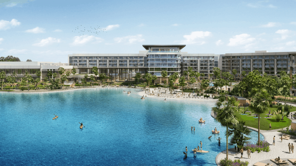 Evermore Orlando Resort’s expansive blue lagoon, surrounded by swaying palm trees, is filled with guests swimming and paddleboarding just steps away from the excitement of Walt Disney World, offering an ideal summer escape for thrill-seekers and families looking to stay near the magic in 2023.