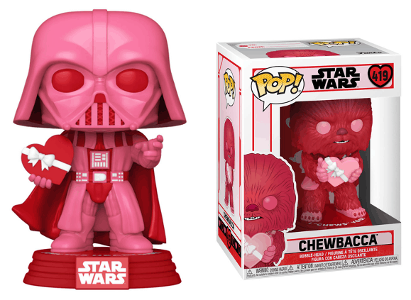 Pink Darth Vader Funko Pop holding a heart-shaped box, displayed beside the boxed red Chewbacca Funko Pop from Star Wars—exclusive theme park-style collectibles designed to thrill Funko and Star Wars fans, inspired by the latest reveals at Funko Fair.