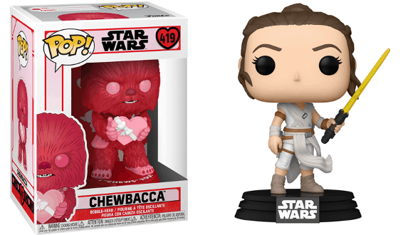 Funko Pop! red Chewbacca figure displayed in its box alongside Rey holding a yellow lightsaber on a Star Wars base—perfect collectibles to bring home the magic of Star Wars as seen at Disney Parks’ Galaxy’s Edge.