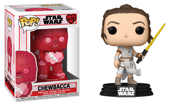 Funko Pop! red Chewbacca figure displayed in its box alongside Rey holding a yellow lightsaber on a Star Wars base—perfect collectibles to bring home the magic of Star Wars as seen at Disney Parks’ Galaxy’s Edge.