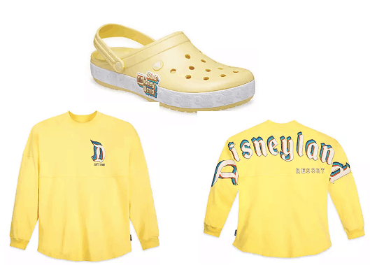 Bright yellow Crocs and a matching Disneyland Resort long-sleeve shirt with bold blue and pink lettering—add these fresh fan favorites to your Disney merch collection, now available on shopDisney.