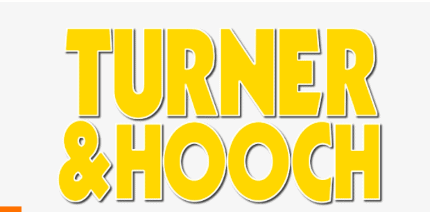 Bold yellow "Turner & Hooch" lettering pops against a light backdrop, evoking the excitement of the Disney+ Turner & Hooch series, complete with Jeff Cardoni’s energetic soundtrack—perfect for Disney fans and theme park enthusiasts.