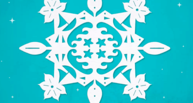 Intricately cut white paper snowflake featuring star and leaf designs, set against a vibrant turquoise backdrop sprinkled with tiny white stars—evoking the dazzling, magical atmosphere of a winter-themed parade or holiday event at your favorite theme park.