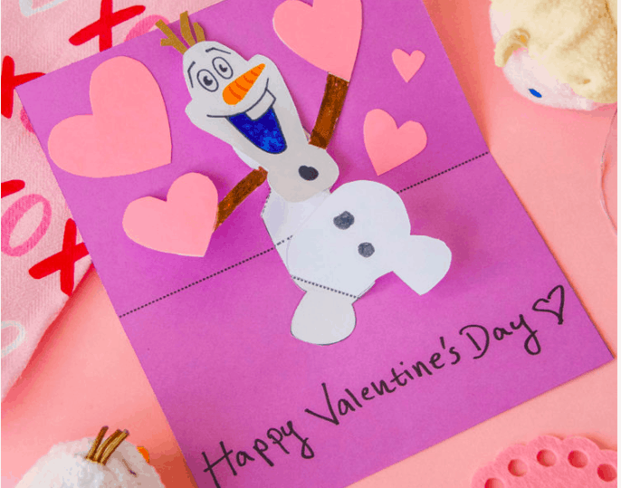 A purple Valentine’s Day card featuring Olaf from Frozen, surrounded by pink paper hearts and “Happy Valentine’s Day” at the bottom—perfect for Disney fans who know that some things are worth melting for.