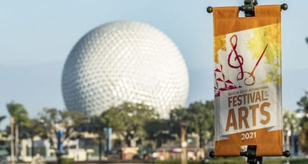 Festival of the Arts 2021 banner set against Epcot's iconic Spaceship Earth, showcasing the colorful excitement and creative energy at Disney EPCOT International Festival of the Arts.