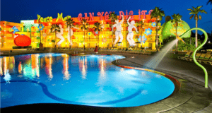 Disney’s Pop Century Resort shines with bold pop art décor, larger-than-life dancing statues, and the legendary Hippy Dippy Pool glowing at night amid towering palm trees—an unmissable attraction freshly enhanced by recent refurbishments for an even more vibrant stay in the heart of Walt Disney World.