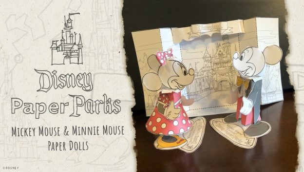 Mickey and Minnie paper dolls pose in front of a whimsical paper castle backdrop with a "Disney Paper Parks" sign, capturing the magic of classic Disney park attractions in a playful, collectible format.