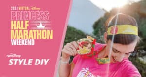 A Disney fan beams with a Princess medal and handmade headband, posing next to festive runDisney Half Marathon graphics—capturing the excitement of Run Like Royalty during a magical Disney event.