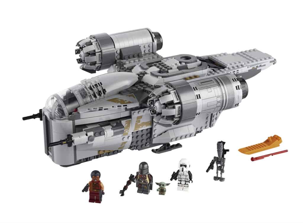 LEGO Star Wars spaceship set displayed with four iconic minifigures, a small green character resembling Grogu, and themed accessories on a white backdrop—an out-of-this-world addition to any Star Wars fan’s collection for immersive play inspired by galactic adventures at themed attractions.