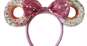 Minnie Mouse-inspired pink sequined headband featuring donut-shaped ears, finished with playful white icing and colorful sprinkles, perfect for your Disney Parks visit.