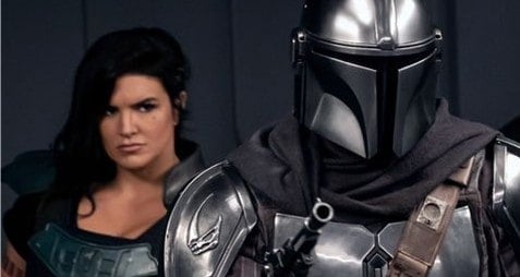The Mandalorian, clad in iconic armor and wielding a blaster, stands ready with Cara Dune at his side—bringing the excitement of Disney’s The Mandalorian to life for fans.