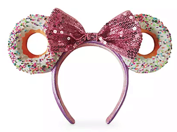 Minnie Mouse-inspired pink sequined headband featuring donut-shaped ears, finished with playful white icing and colorful sprinkles, perfect for your Disney Parks visit.