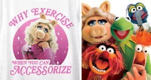 Miss Piggy strikes a pose with the phrase "Why exercise when you can accessorize?" beside a cheerful group of Muppets, capturing the playful spirit found at Muppet-themed attractions in Disney Parks—a fun nod for Muppet Show fans and perfect for guests looking to show off their love for these iconic characters. Now featured on Disney+.