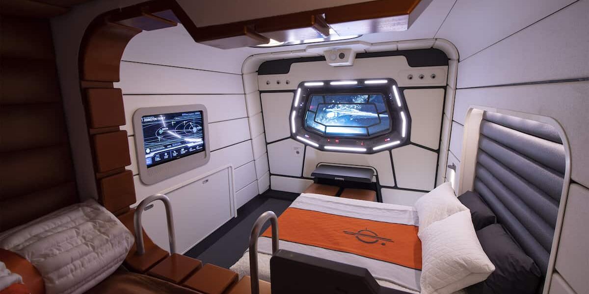 Star Wars: Galactic Starcruiser hotel room featuring a space-inspired window, interactive display screens, and sleek modern bed, capturing the fully immersive atmosphere curated by the Hotel Services Director for fans seeking an out-of-this-world Disney experience.