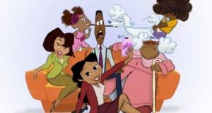 The Proud Family gathers on an orange couch at Disney+, grinning for a lively selfie moment with Penny in the spotlight, capturing the fun spirit of The Proud Family: Louder and Prouder as if they're part of the entertainment magic themselves.