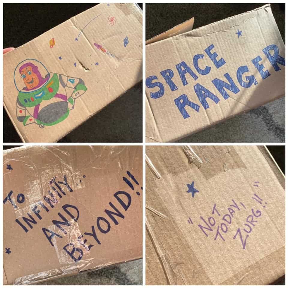 A cardboard box adorned with Buzz Lightyear illustrations, “SPACE RANGER,” and Toy Story quotes in bold marker—channeling the playful spirit of Pixar Pier at Disneyland Resort. This lost and found creation could have easily come from a Cast Member eager to help a young guest’s favorite Space Ranger make his way back home—straight out of Andy’s Room and ready for another galactic adventure.