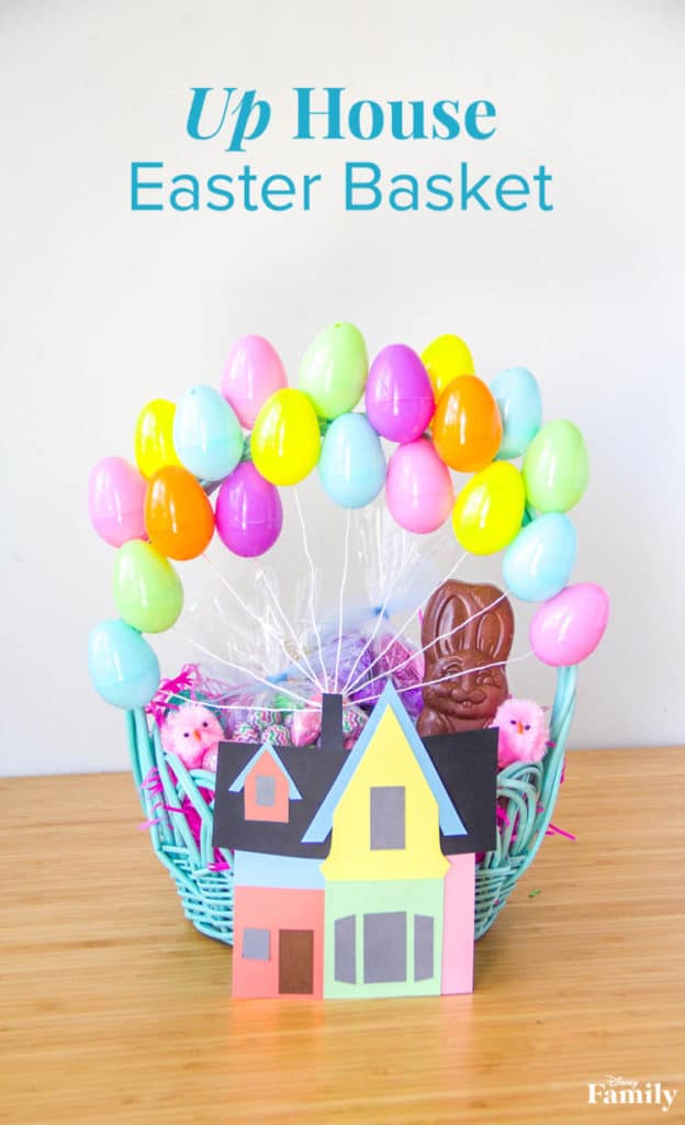 Disney Up–themed Easter basket featuring vibrant egg balloons and a miniature paper house from the beloved film "Up," displayed on a wooden table, evoking the whimsical atmosphere of Pixar Pier during an Easter celebration.