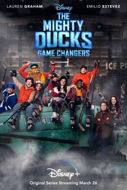 The Mighty Ducks cast, suited up in hockey gear, gather atop a classic Zamboni for a photo op alongside their coaches, celebrating the legacy of the iconic film series and spotlighting the Disney+ original "Game Changers.
