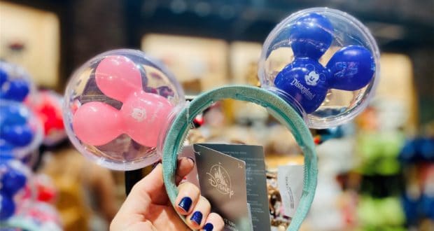 Discover the latest Disney Mickey Mouse ears headband, featuring pastel pink and blue balloon ears, available now at Disney Springs.