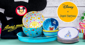 Disney-themed bowls, plates, and cups burst with color next to a Mickey Mouse ear hat and a small plant, capturing the magic of favorite Disney characters in this latest shopDisney collection—perfect for fans looking to bring theme park excitement to their tables at home.