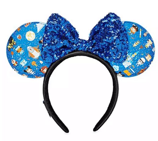 Disney Parks Ear Headband featuring a sparkling blue sequin bow and round blue ears adorned with whimsical cartoon space and animal motifs—an enchanting accessory to elevate your Disney adventure, available at shopDisney.