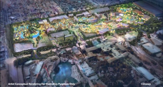 A dazzling nighttime aerial shot of Disneyland, illuminated with vibrant lights highlighting iconic attractions, winding pathways, and the surrounding cityscape—showcasing the park’s magical transformation and immersive Disney-themed details.