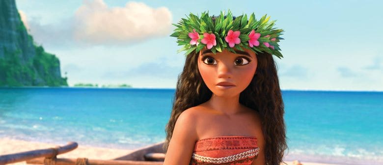 An animated girl with flowing hair and a flower crown stands on the sandy shore of a beach, with sparkling ocean waves and lush trees behind her, looking like she just stepped out of a magical movie adventure you’d expect to experience at Universal Studios or Disneyland this March.