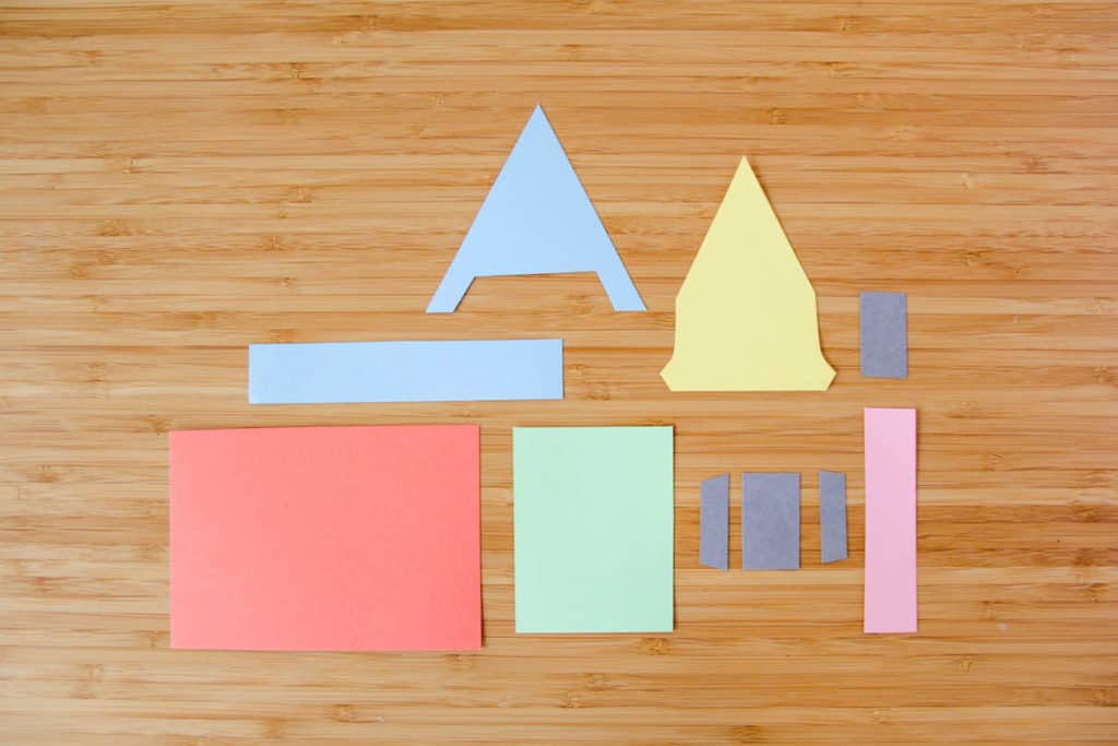 Vibrant paper shapes inspired by Disney Pixar’s Up arranged on a wooden table, ready for a creative activity or to add festive flair to an Up-themed Easter celebration at Disney Parks.