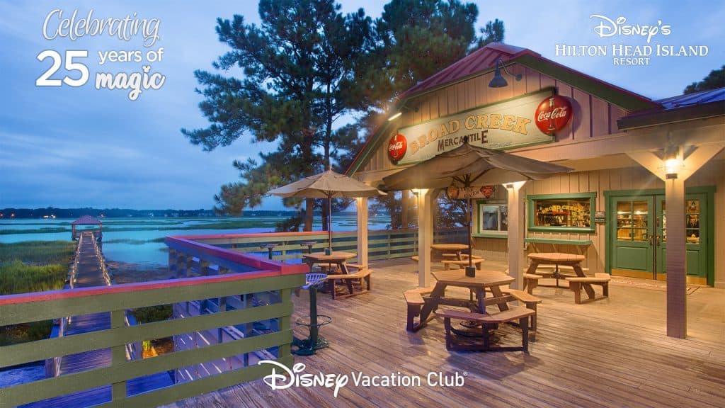 Experience the magic of Disney’s Hilton Head Island Resort as you dine outdoors, soaking in views of peaceful waters at sunset. The setting features iconic Disney elegance with charming umbrellas and comfortable tables, inviting you to relax and enjoy a signature resort meal surrounded by the laid-back coastal atmosphere unique to this Disney destination.