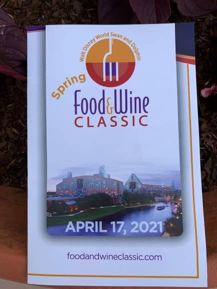 Promotional poster for the 2021 Spring Food & Wine Classic at Disney’s Swan and Dolphin Resort, featuring the event date April 17, with resort branding and official event website visible.