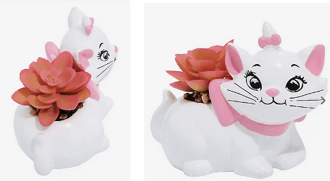 Marie from The Aristocats comes to life in this Disney-inspired white ceramic planter, complete with charming painted features and a playful pink faux succulent. Displayed from two angles, it's a perfect collectible for any Disney fan's home decor.