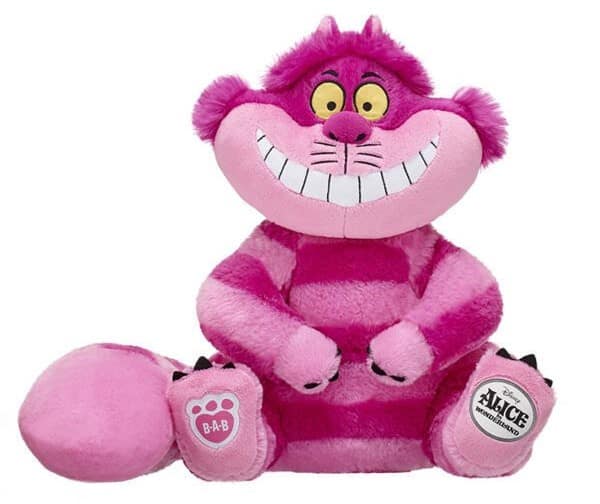 The Cheshire Cat plush toy, with its iconic pink and purple stripes and mischievous grin, brings the whimsical spirit of Disney’s "Alice in Wonderland" to life just like the magical souvenirs found at Disneyland or Walt Disney World.
