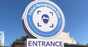 A round sign announces "Facial Recognition Test" above an icon of a masked face, with "Entrance" below—evoking the cutting-edge entry technology you’d expect at Disney’s Magic Kingdom.