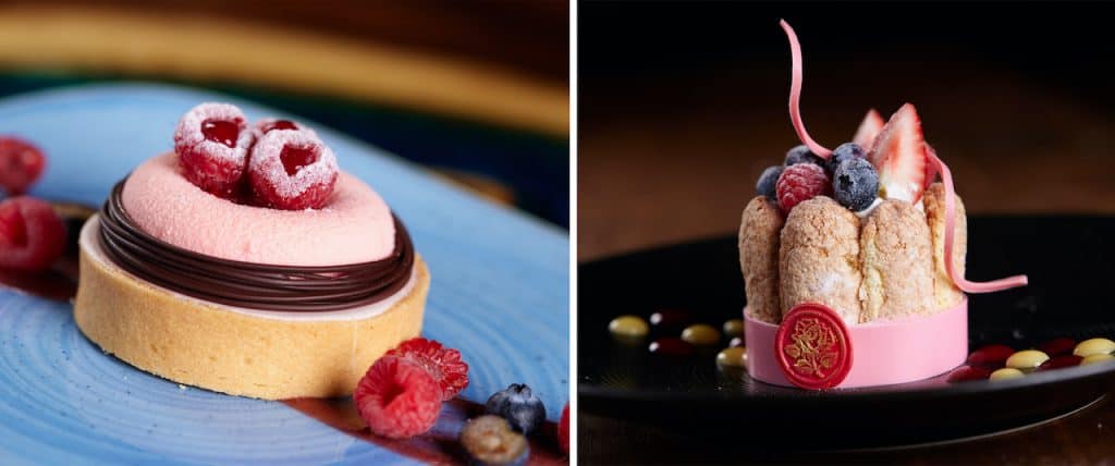 Delicious berry-themed desserts served at Walt Disney World—one raspberry tart and one charlotte cake topped with mixed berries—ready for guests to savor as part of a magical Mother’s Day Foodie Guide celebration.