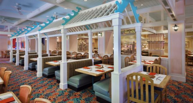 Cape May Café at Disney is ready to welcome guests back with its signature blue booths, wooden chairs, vibrant patterned carpet, and elegant white dividers—all combining for a warm and lively reopening atmosphere that theme park fans will love.
