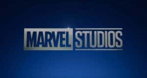 Marvel Studios logo against a vibrant blue backdrop with metallic silver lettering, capturing the thrill of new Marvel attractions and live shows coming soon to your favorite theme parks.