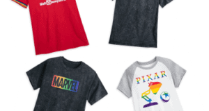 Four graphic t-shirts showcasing Disney Pride Month, Star Wars, Marvel, and Pixar designs displayed on a white background—perfect for theme park fans ready to sport their favorite brands at the parks.