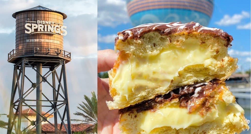 The iconic Disney Springs water tower rises in the background while a guest enjoys a mouthwatering Nutella Boston Cream Donut coated with chocolate glaze, savoring this sweet treat in the lively outdoor atmosphere of Disney Springs.